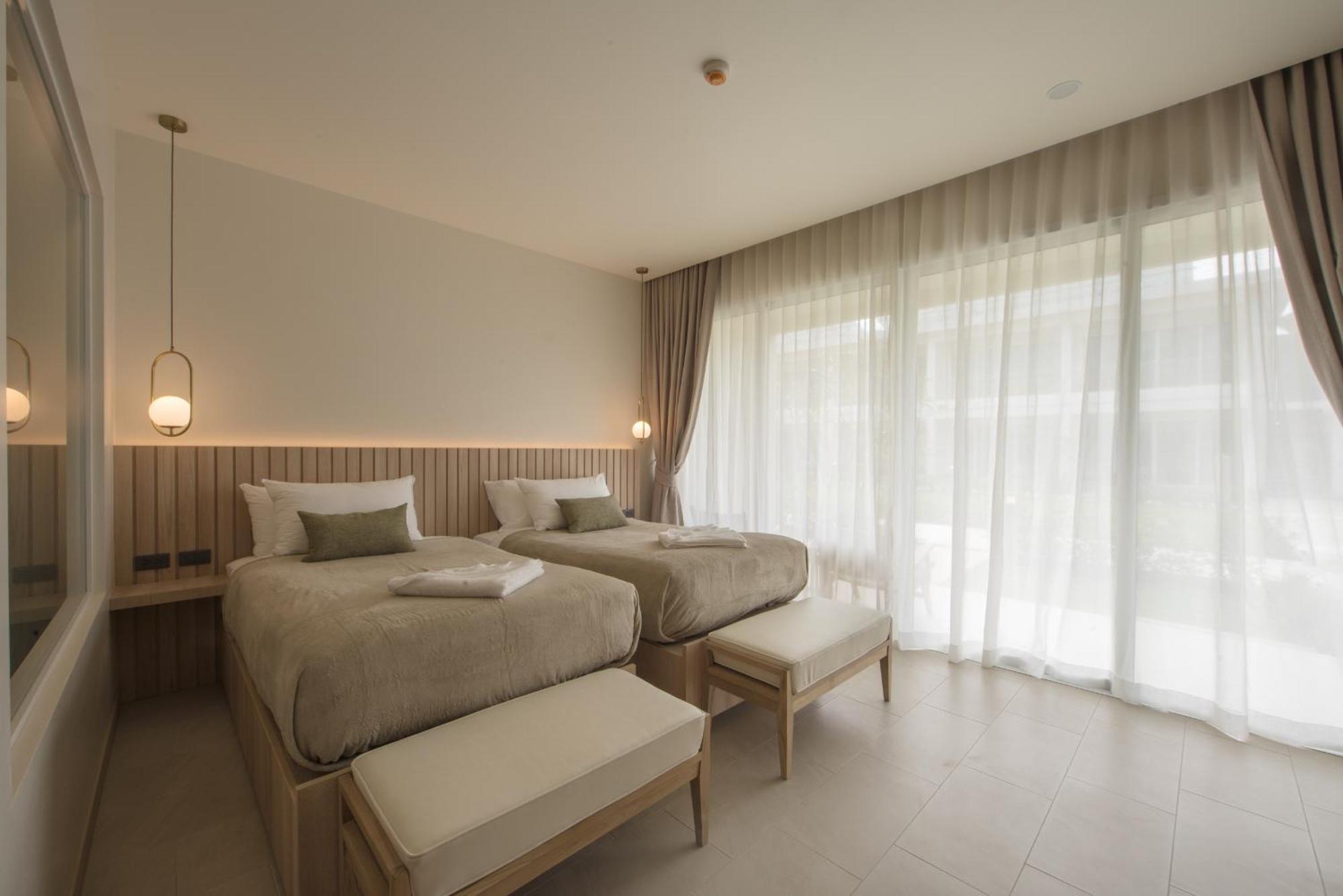 Deluxe Zimmer mit Kingsize-Bett oder 2 Einzelbetten und Gartenblick