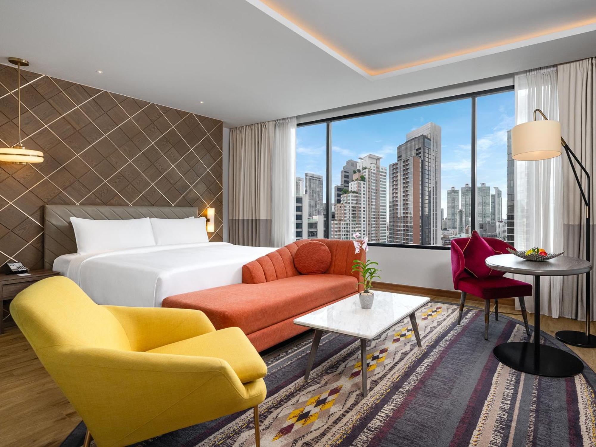 Suite Deluxe con cama doble grande y vistas a la ciudad